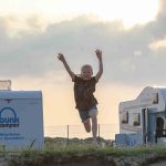 A family enjoying their half term campervan holiday