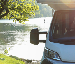 Image of a motorhome outdoors in nature. Being around nature has direct links to improve our overall health,