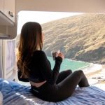 girl on the bed of bunk campers aero campervan