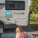 Bunk Campers Horizon motorhome exterior wth girl