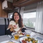 Bunk Campers Horizon motorhome dining with woman